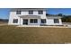 Two-story house with white siding, black windows, and a covered porch at Tbd 9 Casey Dr., Nichols, SC 29581