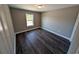 Spacious bedroom with dark laminate floors and neutral walls at Tbd20 Casey Dr., Nichols, SC 29581