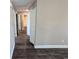Clean hallway with dark laminate flooring and neutral walls at Tbd20 Casey Dr., Nichols, SC 29581