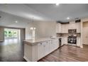 Modern kitchen with white cabinets and quartz countertops at Tbd1 Kapalua Loop, Little River, SC 29566