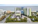 Aerial view of oceanfront resort with ample parking at 1105 S Ocean Blvd. # 728, Myrtle Beach, SC 29577