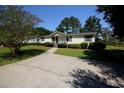 House with a spacious yard and driveway at 894 S Marlin Circle, Murrells Inlet, SC 29576