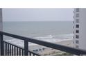 Balcony overlooking the ocean with beach and building views at 1501 S Ocean Blvd. # 1048, Myrtle Beach, SC 29577