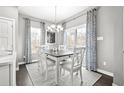 Bright dining room with table and chairs, hardwood floors at 324 C Golan Circle # C, Myrtle Beach, SC 29579