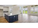 Open floor plan kitchen with large island, breakfast nook, and backyard view at 239 Bluestem Loop, Little River, SC 29566