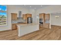 Spacious kitchen with island and hardwood floors at 1228 Colusa Ct., Little River, SC 29566