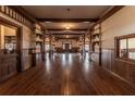 Long hallway with wood floors and walls, leading to other rooms at 3215 Bluff Rd., Marion, SC 29571