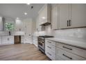 Modern kitchen with white shaker cabinets, stainless steel appliances and quartz countertops at 209 Brush Ct., Little River, SC 29566