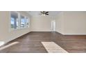 Spacious living room with hardwood floors and large windows at 547 Beckham Ct., Murrells Inlet, SC 29576