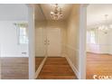 Bright entryway with hardwood floors and a large mirror at 1002 Evans Rd., Marion, SC 29571