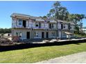 New construction townhouses with gray siding and balconies at 801 Rebecca Ln. # 7B, Myrtle Beach, SC 29577