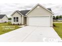 Beige one-story house with a two-car garage at 2819 Biscane Ct., Conway, SC 29527