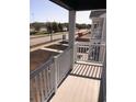 White railing balcony overlooking a street and green space at 861 Maxine Ct. # 4A, Myrtle Beach, SC 29577