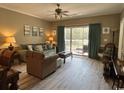 Living Room with access to balcony and neutral decor at 4655 Wild Iris Dr. # 203, Myrtle Beach, SC 29577