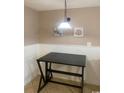 Small dining area with a dark brown table and wall art at 1880 Colony Dr. # 12-F, Surfside Beach, SC 29575