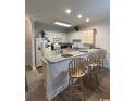 Kitchen with granite countertop and breakfast bar at 4843 Luster Leaf Circle # 102, Myrtle Beach, SC 29577
