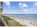 Stunning panoramic view of the beach from a balcony at 603 S Ocean Blvd. # 1011, North Myrtle Beach, SC 29582