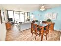 Bright dining area with tile floors and ocean view at 1012 N Waccamaw Dr. # 103, Garden City Beach, SC 29576