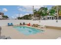 Shared backyard pool with patio furniture and grilling area at 1418 S Ocean Blvd., North Myrtle Beach, SC 29582