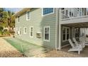 Side yard with shuffleboard and patio seating at 1906 S Ocean Blvd., North Myrtle Beach, SC 29582