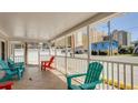 Relaxing front porch with colorful seating at 510 Hillside Dr. S, North Myrtle Beach, SC 29582