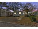 Single story home with a ramp, viewed at dusk at 6001 - Mh197 South Kings Hwy., Myrtle Beach, SC 29575