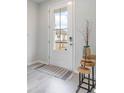 Bright entryway with white door, wood-look floors, and stylish decor at 263 Lassoed Circle, Murrells Inlet, SC 29576