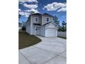 Two-story home with white garage door and light beige siding at 1726 Cenith Dr., North Myrtle Beach, SC 29582