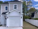 Two-story house with white garage door and vinyl siding at 1726 Cenith Dr., North Myrtle Beach, SC 29582