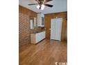 Finished basement with wet bar and wood flooring at 766 Highway 544, Conway, SC 29526