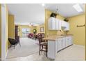 Small kitchen with white cabinets and partial view of living area at 2050 Cross Gate Blvd. # 303, Myrtle Beach, SC 29575