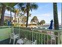 Balcony view of the pool and ocean, with two chairs available for relaxing at 1105 S Ocean Blvd. # 134, Myrtle Beach, SC 29577