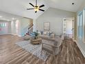 Open living room with high ceiling, stylish furniture, and hardwood floors at 370 Long Meadow Dr., Loris, SC 29569