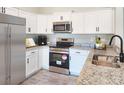 Modern kitchen with white cabinets, granite counters, stainless steel appliances at 370 Long Meadow Dr., Loris, SC 29569