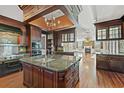 Spacious kitchen with large island, dark wood cabinetry, and high-end appliances at 101 Greenwich Dr., Georgetown, SC 29440