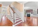 Elegant hardwood staircase and foyer with hardwood floors at 101 Greenwich Dr., Georgetown, SC 29440