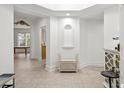 Bright entryway with tile flooring, bench, and views into other rooms at 2180 Waterview Dr. # 837, North Myrtle Beach, SC 29582