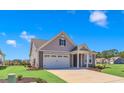 Charming house with gray siding, white trim, and a two-car garage at 1216 Colusa Ct., Little River, SC 29566