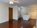Living room with hardwood floors and open concept kitchen at 178 Salt Marsh Circle # 30F, Pawleys Island, SC 29585