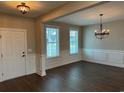 Formal dining room with hardwood floors and elegant chandelier at 5048 Vinesia Dr., Myrtle Beach, SC 29579