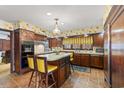 Spacious kitchen with island and wooden cabinets at 5 Jessamine St., Andrews, SC 29510