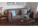 Living room with sofa, coffee table, and end tables at 14290 Ocean Hwy. # 103, Pawleys Island, SC 29585