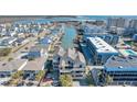 Aerial view of a three-story building near the water, with other houses and a beach in the background at 206 60Th Ave. N # 203, North Myrtle Beach, SC 29582