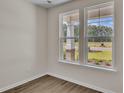 Spacious office with large windows, hardwood floors, and neutral paint at 120 Little Cedar Dr., Loris, SC 29569