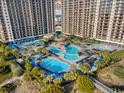 Resort pool area with multiple pools and lounge chairs at 100 North Beach Blvd. # 207, North Myrtle Beach, SC 29582