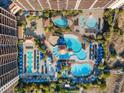 Aerial view of resort-style pool area with multiple pools, loungers, and a large building at 100 North Beach Blvd. # 207, North Myrtle Beach, SC 29582