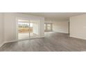 Bright living room with sliding glass doors leading to a patio at 4246 Milkweed Rd., Shallotte, NC 28470