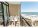 Balcony with two chairs and ocean views at 4800 S Ocean Blvd. # 508, North Myrtle Beach, SC 29582