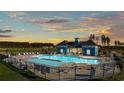 Community pool with a clubhouse and plenty of lounge chairs at 3051 Deerberry Place, Longs, SC 29568