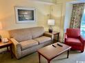 Relaxing living room with sofa, chair, and coffee table at 14290 Ocean Highway # 111, Pawleys Island, SC 29585